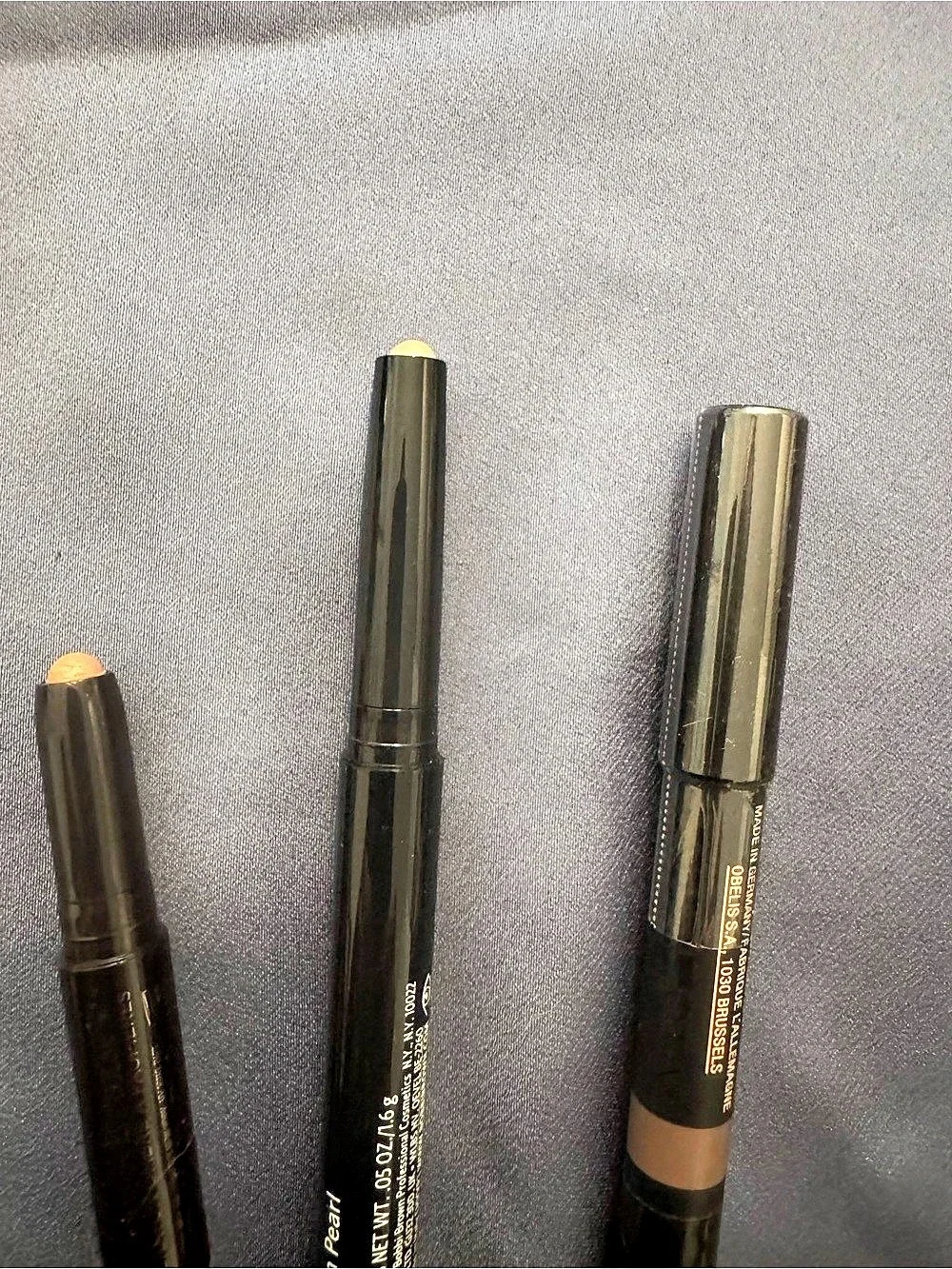 Bobbi Brown Sun Pearl, Nudestix taupe, and delux Laura Mercier eyeshadow crayons